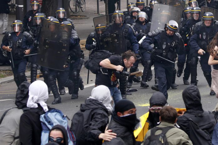 Demonstrators clash with French riot police during a march in Paris, France, to demonstrate against the new French labour law, September 15, 2016. REUTERS/Charles Platiau