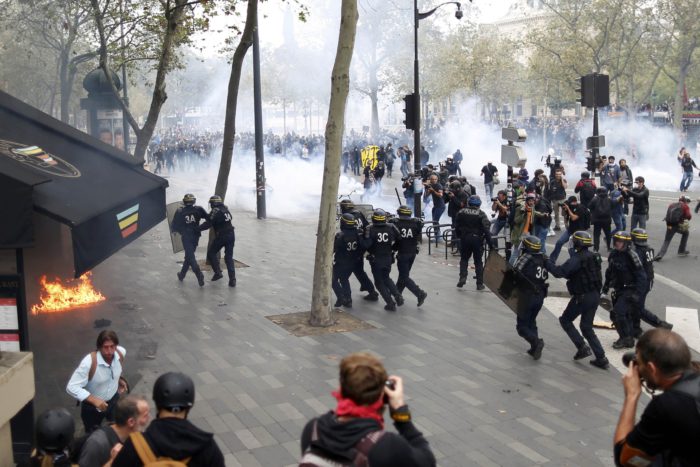 Demonstrators clash with French riot police during a march near the Place de la Republique square in Paris, France, to demonstrate against the new French labour law, September 15, 2016. REUTERS/Charles Platiau