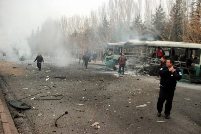 People react after a bus was hit by an explosion in Kayseri, Turkey, December 17, 2016. Turan Bulut/ Ihlas News Agency via REUTERS ATTENTION EDITORS - THIS PICTURE WAS PROVIDED BY A THIRD PARTY. FOR EDITORIAL USE ONLY. NO RESALES. NO ARCHIVE. TURKEY OUT. NO COMMERCIAL OR EDITORIAL SALES IN TURKEY.